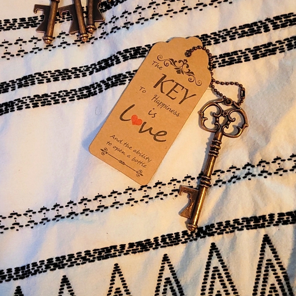 20 key bottle openers with love tags